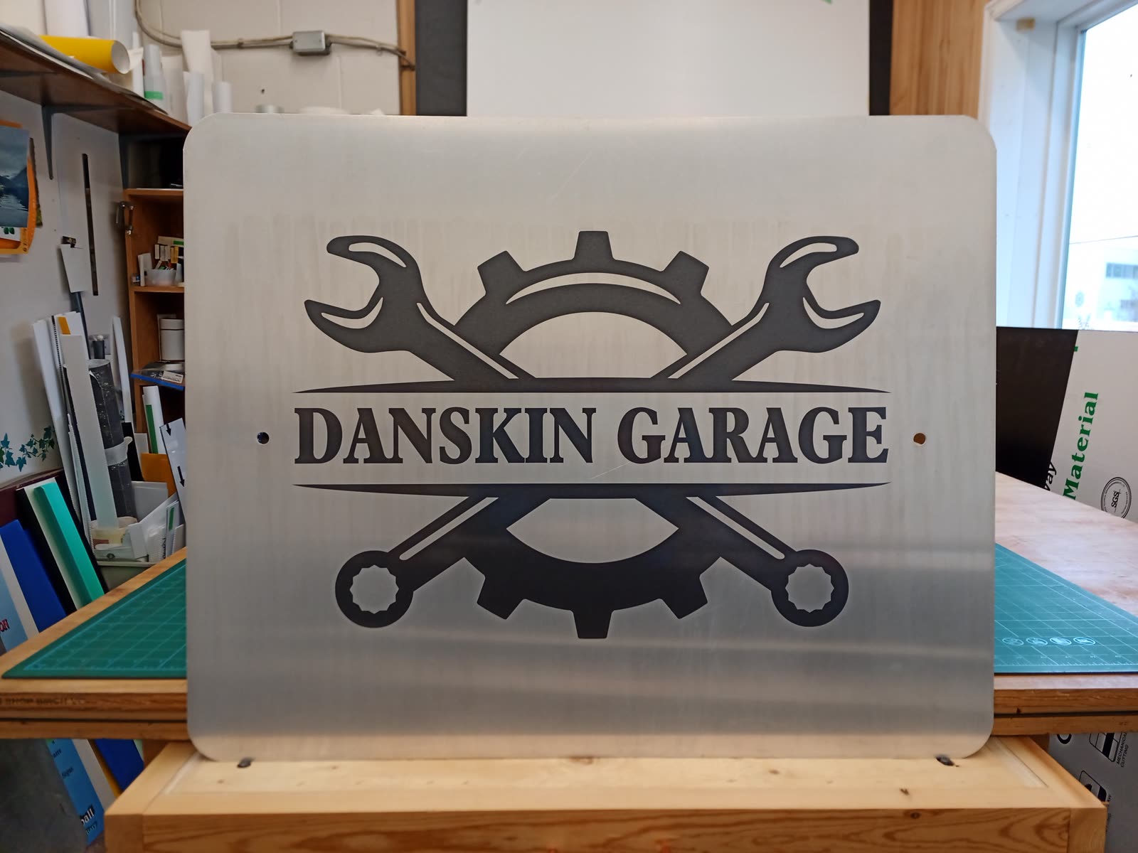 Etched metal Danskin Garage sign